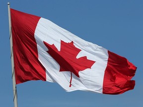 The Great Canadian Flag flies high and proud in downtown Windsor. This Canada Day is a time for reflection following recent discoveries of hundreds of unmarked graves of Indigenous children at former residential schools.