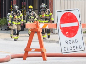 Chatham-Kent firefighters leave a business on Erie Street North while investigating a potential gas leak in downtown Wheatley in July. (Mark Malone/Chatham Daily News)