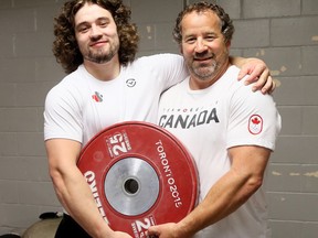 Boady Santavy, left, and his father/coach Dalas Santavy of Sarnia, Ont., are on the Canadian weightlifting team for the Tokyo Olympics. Photo taken in Sarnia, Ont., on Tuesday, July 13, 2021. Mark Malone/Chatham Daily News/Postmedia Network