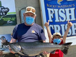 As of July 27, Bob McLean of Monkton, Ont., led the way in the Lake Huron Fishing Club's Chantry Chinook Classic Salmon Derby with a 17.39-pound chinook salmon. McLean posed with the leading salmon and his grandson by his side Tuesday morning. More than 1,000 anglers will try their luck in Lake Huron and Georgian Bay with the derby closing at 2 p.m. on Aug. 2. Photo supplied