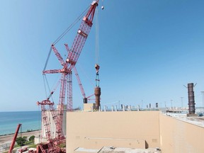 A Mammoet PTC-35 crane lifts the first of eight steam generators - each weighing approximately 320,000 pounds - out of Unit 6 at Bruce Power, marking a major milestone in the multi-year major component replacement project. Nick Menzies/supplied