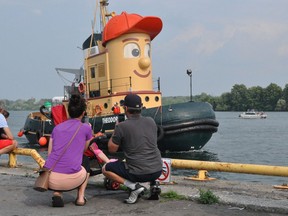 Theodore Too, the official replica of Theodore Tugboat beloved by fans of the television show, docked at the Cornwall harbour on Tuesday July 6, 2021 in Cornwall, Ont. No tours were available, but plenty of people came down to have their photos taken with the famous craft. He’s on his way to his new home in Hamilton. Francis Racine/Cornwall Standard-Freeholder/Postmedia Network