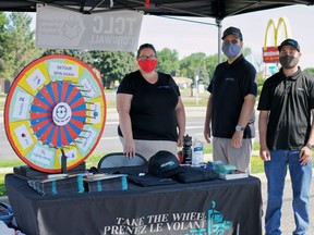 Carolyn Eva and Jason Setnyk from the Tri-County Literacy Council stand with Take the Wheel campaigners looking to enroll more truck driving licensees on Saturday, July 10, 2021 in Cornwall, Ont. Jordan Haworth/Cornwall Standard-Freeholder/Postmedia Network