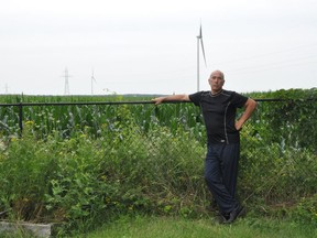 Randal Lamb stands in the rear of his property, which is overlooked by one of the Nation Rise Wind Farm's turbine, on Saturday July 17, 2021 in Cornwall, Ont. Francis Racine/Cornwall Standard-Freeholder/Postmedia Network