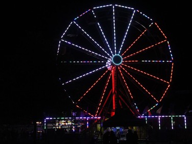 A midway ride lighting up the night sky on Saturday at Cornwall Ribfest. Photo on Saturday, July 24, 2021, in Cornwall, Ont. Todd Hambleton/Cornwall Standard-Freeholder/Postmedia Network