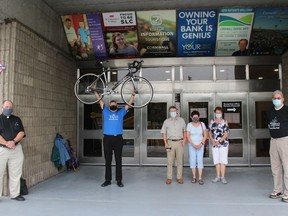 Some of the top supporters of the Bike-a-Thon Plus event are (from left at the civic complex doors, with event chair Peter Asquini at far right) Rev. Claude Thibault, Rev. Louis Groetelaars, Stewart and Lynda MacDonald, and Sheila MacDonald. Photo on Tuesday, July 27, 2021, in Cornwall, Ont. Todd Hambleton/Cornwall Standard-Freeholder/Postmedia Network