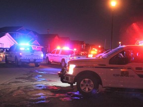 RCMP and Municipal Enforcement vehicles together during a parade through Jumping Pound on December 2, before tougher public health measures were introduced in town and across the province.