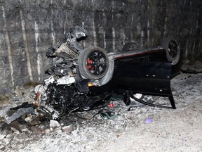 A destroyed Honda Civic after it rolled off the Montreal Street off-ramp after the driver sped it on Highway 401 at about 200 km/h in Kingston, Ont., on Oct. 26, 2020.