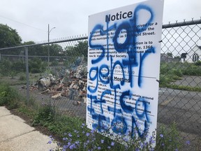 Local artist Nicholas Crombach's temporary public artwork "Every slated lot has a previous story" and a city notice detailing a proposed development on the lot where the installation sits were vandalized on June 27.