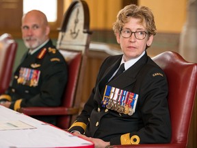 Reviewing officer Maj.-Gen. Craig Aitchison, from left, and incoming RMC Commandant Commodore Josee Kurtz listen to outgoing commandant Brig-Gen. Sebastien Bouchard speak during the change of command ceremony at RMC on Thursday morning in Kingston.