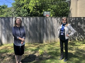 Catherine Oxford and Ruth Woodman stand outside one of of the Kingston Youth ShelterÕs Youth Transition Homes in June 2021. Brigid Goulem/The Kingston Whig-Standard/Postmedia Network