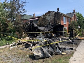 Kingston Police are investigating after the body of a person was found in the debris of a garage fire on July 14.
