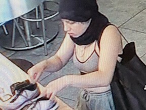 Kingston Police are searching for this woman after another woman's bank cards were stolen from her home and used at various stores on July 17. Supplied Photo