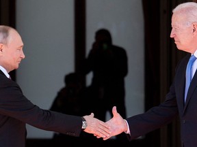 Russia's President Vladimir Putin, left, shakes hands with U.S. President Joe Biden prior to the U.S.-Russia summit at the Villa La Grange, in Geneva, Switzerland, on June 16.