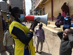 A boy reacts as a community health worker calls on children to come out and be immunized to fight against polio virus in Kiamako, Nairobi, on July 19, 2021. Three million children across 13 counties of Kenya are to be vaccinated against polio by the government, UNICEF, World Health Organization and partners, after the virus was confirmed to be circulating. The WHO says spread of diseases like measles, polio or meningitis could be catastrophic for countries already battling COVID-19.