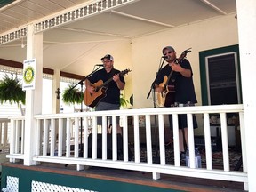 Mark Hunt and Brian Frommer played on Sydenham Street in Gananoque as part of the PorchJAM series of outdoor concerts presented by Cliff Edwards. Running over two consecutive weekends, nine concerts are being held on front porches in Gananoque to bring music and happiness to local residents during Phase 2 of the provincial lockdown.  
Supplied by Gwen Hundrieser