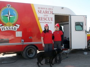 Huron and Area Search and Rescue (HASAR) is holding a fundraising golf tournament Sat., Sept. 18 at Woodlands Links Golf Course outside Clinton. Pictured, HASAR members Carrie Hohner, left, and Jess Keller attended an adventure event at Morrison Dam outside Exeter on March 20-21. Their friend Bueller also helped.