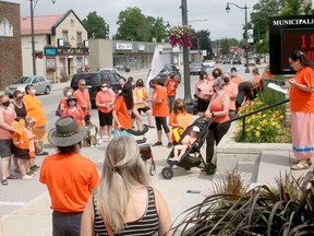 Supporters gathered at Exeter's town hall for a solidarity walk July 1 to support the Indigenous community and raise awareness about the history of Canada's residential school system. At right, Exeter's Monique Pregent spoke before the walk.