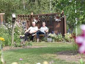 Reg and Linda Petrinchuk have turned their acreage near White Fox from solid bush to a home and yard that includes over two acres of flower gardens. Photo Susan McNeil.