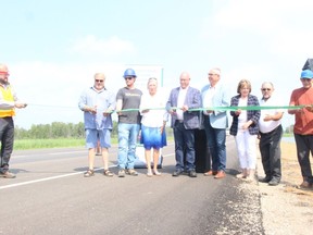 The province cut the ribbon on new passing lanes on Highway 2 recently which improves traffic flow on the way to Christopher Lake. Left to right: Reeve Don Fyrk of the RM of Buckland, project manager Rob Meyers, Nadine Wilson, Fred Bradshaw, Joe Hargrave, Alana Ross, Delbert Kirsch and John Halkett of the La La Ronge Indian Band (LLIB) cut the ribbon on the new passing lanes on Highway 2 north of Prince Albert last week. Photo courtesy Prince Albert Daily Herald.