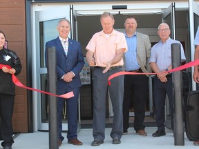Tim Keller and Morley Doerksen had the honour of cutting the ribbon on the new Co-op Wine, Beer and Spirits store in Nipawin on July 29. Photo Susan McNeil.