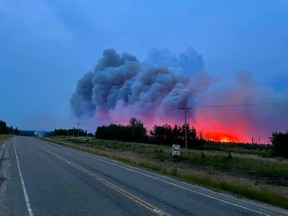 Fires northwest of Nipawin have meant some road closures. This photo was taken at 9:00 pm on July 15 between Caribou Creek and Smeaton. Photo courtesy Mary Fox.
