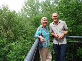Shawna Macivor and Lloyd Lewis of NeighbourWoods North stand in front of a backdrop of trees at the Centennial Tower in Owen Sound. The pair, along with fellow organization member Gord Edwards, asked the city to apply to become a Tree City of the World in 2021. 
 DENIS LANGLOIS