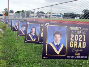Lawn signs featuring photos of the Bishop Smith Class of 2021 lined the entrance to the Pembroke high school. Families were encouraged to take the signs home and display them proudly.