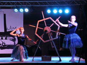 From left, April Bergeron, and Evaleigh McDonald dance ballet during Starz In Motion's Ignite the Blue Hour on July 12 at the Skylight Drive-In in Pembroke.