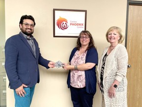 The Phoenix Centre for Children and Families has a new, updated logo after a successful design contest for Renfrew County artists this past spring. Tara Yourth's (centre) logo was chosen from more than 50 entries. She recently received the grand prize of a $1,000 Visa gift card from Dez Bair-Patel, president Phoenix Centre board of directors, and Karen Roosen (right), board vice-president.