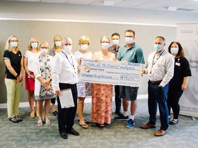 Pembroke resident Harold Smallpiece generously donated $540,000 to the Pembroke Regional Hospital Foundation through planned giving in his will. Taking part in the cheque presentation (from left) were Sandra Farrell, Laurie Menard, Sabine Mersmann, Beth Brownlee, Roger Martin, Lisa Edmonds, Connie O'Connor, Martin Burger, Marvin Smallpiece, Pierre Noel, Leigh Costello.