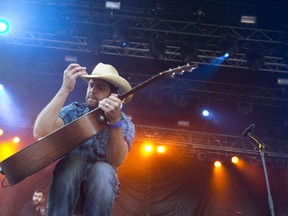 Dean Brody plays for a screaming crowd at Rock The Park presents Gone Country Music Festival in Harris Park in London on July 23, 2014. (Free Press file photo)