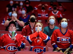 Montreal Canadiens fans react as they watch the second away game of the Stanley Cup Finals against Tampa Bay at the Bell Centre on Wednesday night. Down 2-0 in the series, the Canaidiens will host game three Friday night.
REUTERS/Christinne Muschi