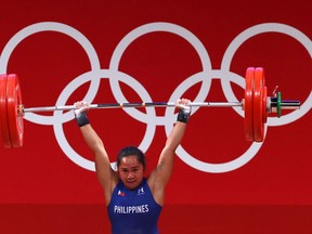 Weightlifter Hidilyn Diaz of the Philippines won her country's first-ever Olympic gold medal in the women's 55-kilogram class at the Tokyo Summer Games.
