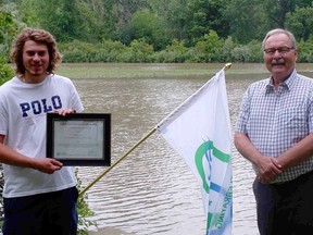 Zachary Zavitz (left) of Strathroy is awarded with the A.W. Campbell Memorial Scholarship by St. Clair Region Conservation Authority chair Joe Faas. Handout