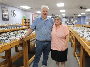 Roland and Mary Anne Peloza stand inside Cheeky Monkey, the record, CD and DVD store they have run in Sarnia's downtown for 22 years. The couple plans to close the store and retire this fall.