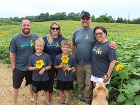 Miracle Max's Minions, a project in memory of Max Rombouts, a two-year-old from Thedford who died in 2019 after battling leukemia, has returned with several fields of sunflowers planted in Lambton County. From left, Max's family Kevin Rombouts, Zachary Rombouts, 8, Jamie Rombouts and Hudson Rombouts, 6, with Brian Schoonjans and Shannon Armstrong, at the field on Douglas Line where the project began.