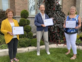 Several members of the Rotary Club of Norfolk Sunrise were presented recently with Paul Harris Fellows. Recipients include, from left,   Mary Mercato, Jim Simpson and Rudi Atkinson.