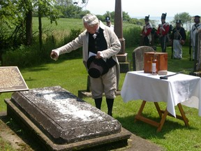 Rev. Nick Wells shares a toast of Irish whiskey at the grave of Col. Thomas Talbot, Saturday at St. Peter’s Cemetery, Tyrconnell, commemorating the 250th anniversary of the birth of the founder of the Talbot Settlement.
Eric Bunnell