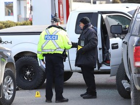 The Special Investigation Unit and Greater Sudbury Police investigate a shooting at the Esso gas station on Regent Street on April 11, 2019. John Lappa/Sudbury Star