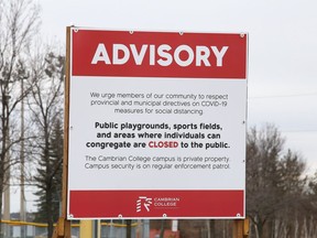 Signs are posted at Cambrian College in Sudbury, Ont. advising the public to follow provincial and municipal COVID-19 directives on campus property. Cambrian, College Boreal and Laurentian University are preparing for a return to classes this fall. John Lappa/Sudbury Star/Postmedia Network