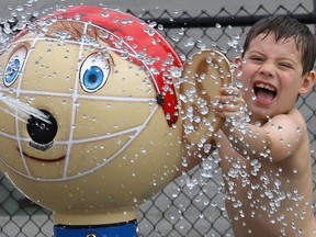 Julien Gaudette, 7, cools off at the splash pad at the DJ Hancock Memorial Park in early June. More city facilities are now open for outdoor recreation as the province has moved into Step 2 of its reopening.