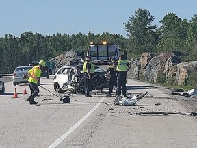 Crews clean up on Highway 69 south of Nelson Road on Tuesday after a driver struck a rock cut and flipped the vehicle. The driver, ason Prasad, 19, was fined Wednesday in Sudbury court. OPP photo