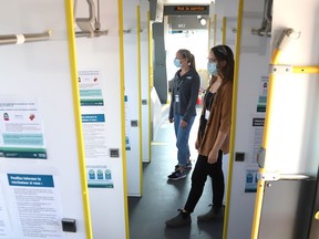 Natalie Lamarche, back, with the City of Greater Sudbury, and Jill Kovala, with Public Health Sudbury and Districts, tour a transit bus that has been converted into a mobile vaccination clinic. Public Health Sudbury and Districts and the City of Greater Sudbury launched the area's first mobile COVID-19 vaccination clinic in Sudbury, Ont. on Monday July 12, 2021. Starting Tuesday, July 13, the mobile clinic will travel to locations in the health unit's service area. John Lappa/Sudbury Star/Postmedia Network