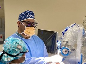 Orthopedic surgeon Kevan Saidi uses a robotic tool called the ROSA Knee for the first time in performing a knee replacement at Health Sciences North. Supplied