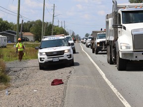 A traffic control worker sustained broken leg bones and bruised ribs after he was struck by a motorcycle Friday in a construction zone on Radar Road.