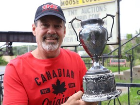 Troy Cameron, of TNT Auctions, holds a trophy he will be auctioning off. John Lappa/Sudbury Star/Postmedia Network