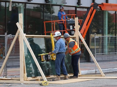 Glass panels were being installed at Place des Arts in downtown Sudbury, Ont. on Tuesday July 27, 2021. The northbound curb lane on Elgin Street between Medina Lane and Larch Street will be closed from 7 a.m. to 5 p.m. until July 29, 2021 while the work is completed. John Lappa/Sudbury Star/Postmedia Network