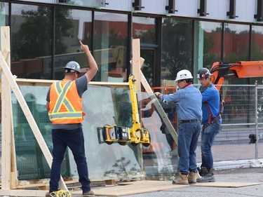 Glass panels were being installed at Place des Arts in downtown Sudbury, Ont. on Tuesday July 27, 2021. The northbound curb lane on Elgin Street between Medina Lane and Larch Street will be closed from 7 a.m. to 5 p.m. until July 29, 2021 while the work is completed. John Lappa/Sudbury Star/Postmedia Network