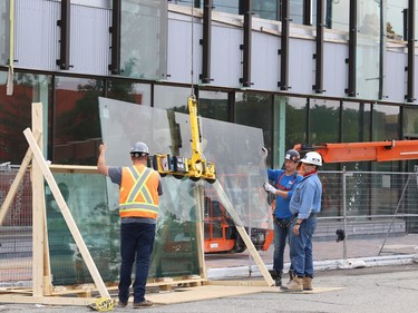 Glass panels were being installed at Place des Arts in downtown Sudbury, Ont. on Tuesday July 27, 2021. The northbound curb lane on Elgin Street between Medina Lane and Larch Street will be closed from 7 a.m. to 5 p.m. until July 29, 2021 while the work is completed. John Lappa/Sudbury Star/Postmedia Network